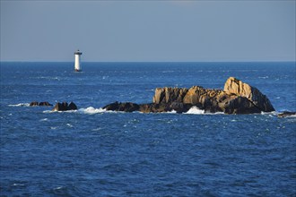 Evening view from the Pointe du Grouin with a view of the Phare de la Pierre-de-Herpin and striking