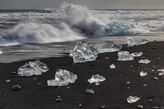 Ice floes on the beach, waves, clouds, winter, Diamond Beach, Breidamerkursandur, Jökulsarlon,