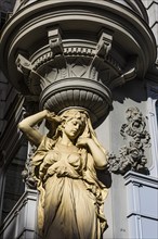 Female stone figure supporting a façade, Graben pedestrian zone, Vienna, Austria, Europe