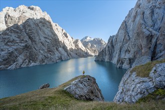 Hiker in front of Kol Suu Mountain Lake, Kol Suu Lake, Sary Beles Mountains, Naryn Province,