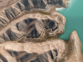 Top-Down, Barren landscape, Aerial view, Erosion landscape with canyons at the river Naryn,