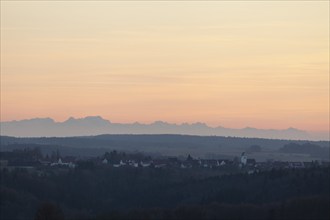 Alpine panorama near Magolsheim. Säntis, Swiss Alps at cloudless sunset with a view of Mehrstetten.