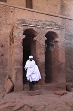 Rock churches of Lalibela, entrance to St Mary's Church and pilgrims, Bete Maryam, Ethiopia, Africa