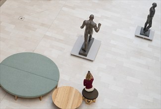 Visitor photographs sculpture of a man, State Museum of Art, Statens Museum for Kunst, SMK,