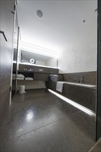 Modern bathroom with large shower, bathtub and illuminated mirror, Mayrhofen, Zillertal, Austria,