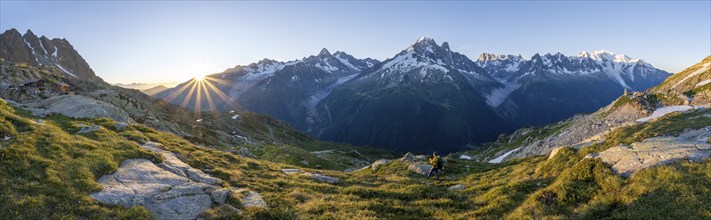 Panorama, morning atmosphere with sun star, Mountain landscape at sunrise, Mountain hut Refuge du