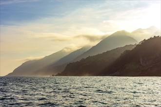 Mountains and forests of Ilhabela island meeting the sea at sunset Ilhabela, Sao Paulo, Brazil,