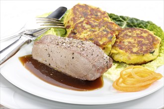 Swabian cuisine, medallions of wild boar with savoy cabbage cakes, meat dish, roasted, hearty, home