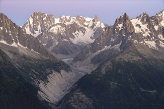 Evening mood with pink evening sky, mountain landscape at sunset, mountain peak Grandes Jorasses