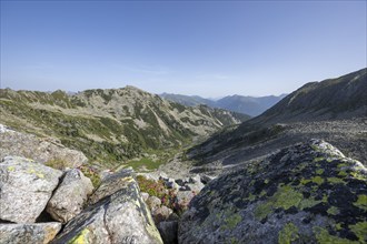 Rocky landscape with a view of a wide valley under a blue sky, Neukirchen am Großvenediger,