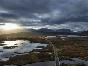 Morning light, cloudy mood, sunbeams, mountain landscape, loch, moor, aerial view, road, autumn,