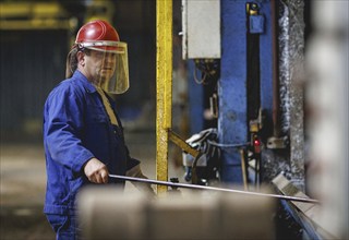 A worker stands at a boiler during a galvanising process. Taken during a press event at The Coatinc