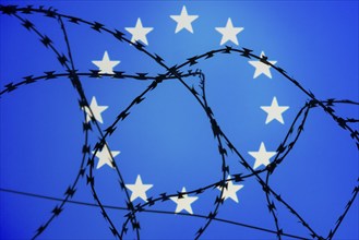 Symbolic image, migration, defence against refugees wanting to enter the EU, barbed wire overarches