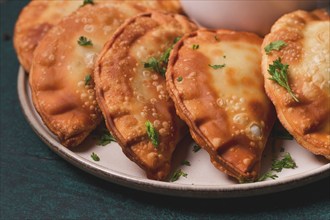 Fried mini pasties, with red sauce, top view, close-up, no people, selective focus