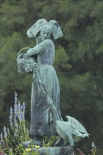 Sculpture Gänseliesel by Albert Schultz 1900, female figure with basket, goose figure and flower