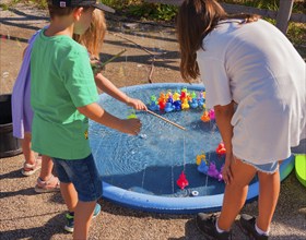 Children play fishing for animals, outdoor area SHOWPALAST MÜNCHEN, stage for shows with