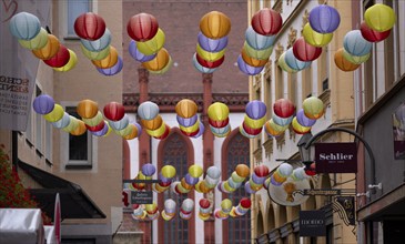 Colourful lanterns, Schustergasse, behind St. Kilian's Cathedral, historic old town, Würzburg,