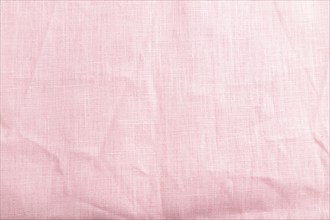 Fragment of smooth pink linen tissue. Top view, flat lay, natural textile background and texture