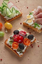 Breakfast, assortment of sandwiches, on white toast bread, top view, no people