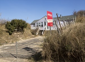 March 2018, Clifftop property collapsing due to coastal erosion after recent storm force winds,