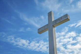 Christianity symbol Easter concept cross in blue sky, AI generated