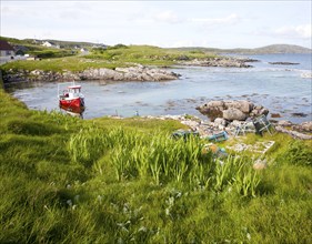 Small fishing boat at moorings on the east coast of Barra, Outer Hebrides, Scotland, UK