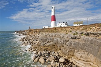 Red and white lighthouse on the coast at Portland Bill, isle of Portland, Dorset, England, United