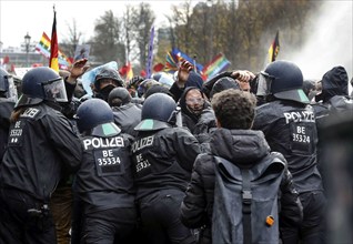 Water cannon in use at the Brandenburg Gate. Once again, thousands of corona deniers are