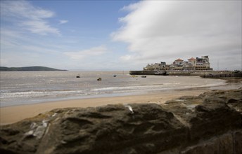 Wide sandy beach looking towards Knightstone Island, Weston super Mare Somerset, England, United