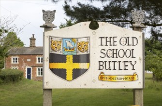 Sign outside closed rural primary school, The Old School, Butley, Suffolk, England, UK