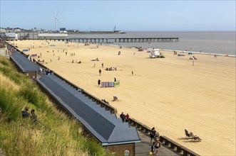 View over roofs of beach huts to Claremont Pier, South Beach, Lowestoft, Suffolk, England, UK