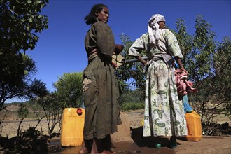 Amhara region, locals fetching water from a well, Ethiopia, Africa