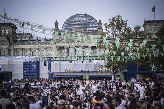 Scenes in the fan zone on Platz der Republik in front of the Reichstag building taken in Berlin, 29