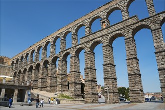 Ancient stone aqueduct in impressive architecture under a blue sky, Aqueduct, Segovia, Castilla y