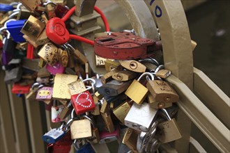 Lover's lock on a railing, love lock is a padlock which, according to custom, is attached to