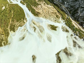 Glacial lake Lac de Chateaupre, lake just below the Moiry glacier, river arms in blue water, aerial