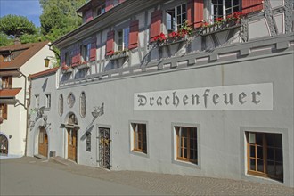 Historical building of the Drachenfeuer restaurant, inscription, shutters, Meersburg, Obersee, Lake