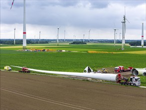 Transport of a 70 metre long rotor blade, construction of a wind power plant in a wind farm near