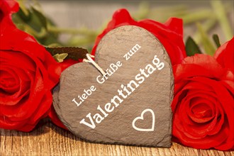 Greetings for Valentine's Day: roses and a heart with the inscription LOVE GREETINGS FOR