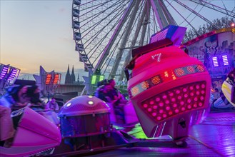 Deutz funfair on the Rhine, at Easter, funfair, break-dancer ride, Ferris wheel, Cologne Cathedral,