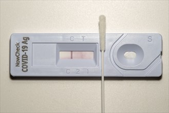 Covid-19 rapid test, antigen test, the abrasion of the swab is dissolved in a liquid and applied to