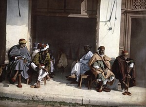 Arabs in a Café, Algiers, Algeria, ca 1890, Historical, digitally restored reproduction from a 19th