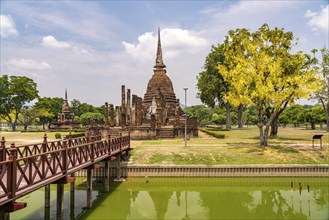 Buddha statue and chedi of the Buddhist temple Wat Sa Si, UNESCO World Heritage Sukhothai