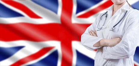 Doctor with crossed arms on UK flag. UK Health and Care concept. Female doctor on UK flag