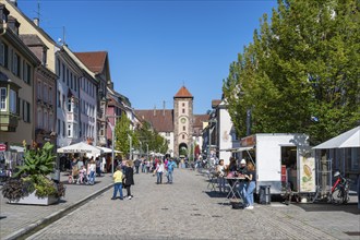 Pedestrian zone, shopping street with the Obertor, historic town gate of Villingen,