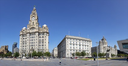 Panoramic view of famous historic buildings under a clear blue sky, Liverpool