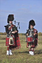 Scottish bagpipers playing pipes and drums, Scotland, UK