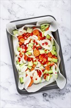 Raw, chopped vegetables in a basket, ingredients for making ossobuco, top view, no people