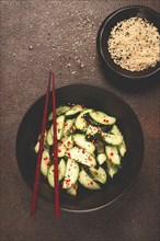 Chinese salad, cucumbers with chili pepper and sesame seeds, homemade, no people