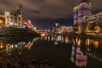 Lights reflected in the Danube Canal, on the left the Urania observatory, on the right illuminated